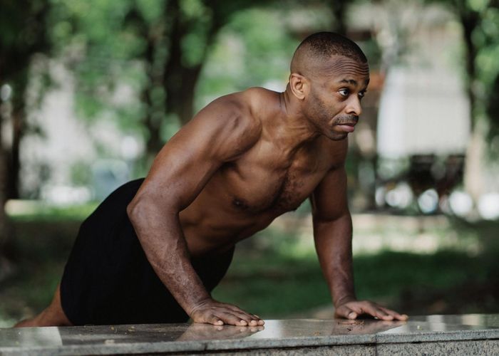 Close up of a man focused during a complex balance exercise
